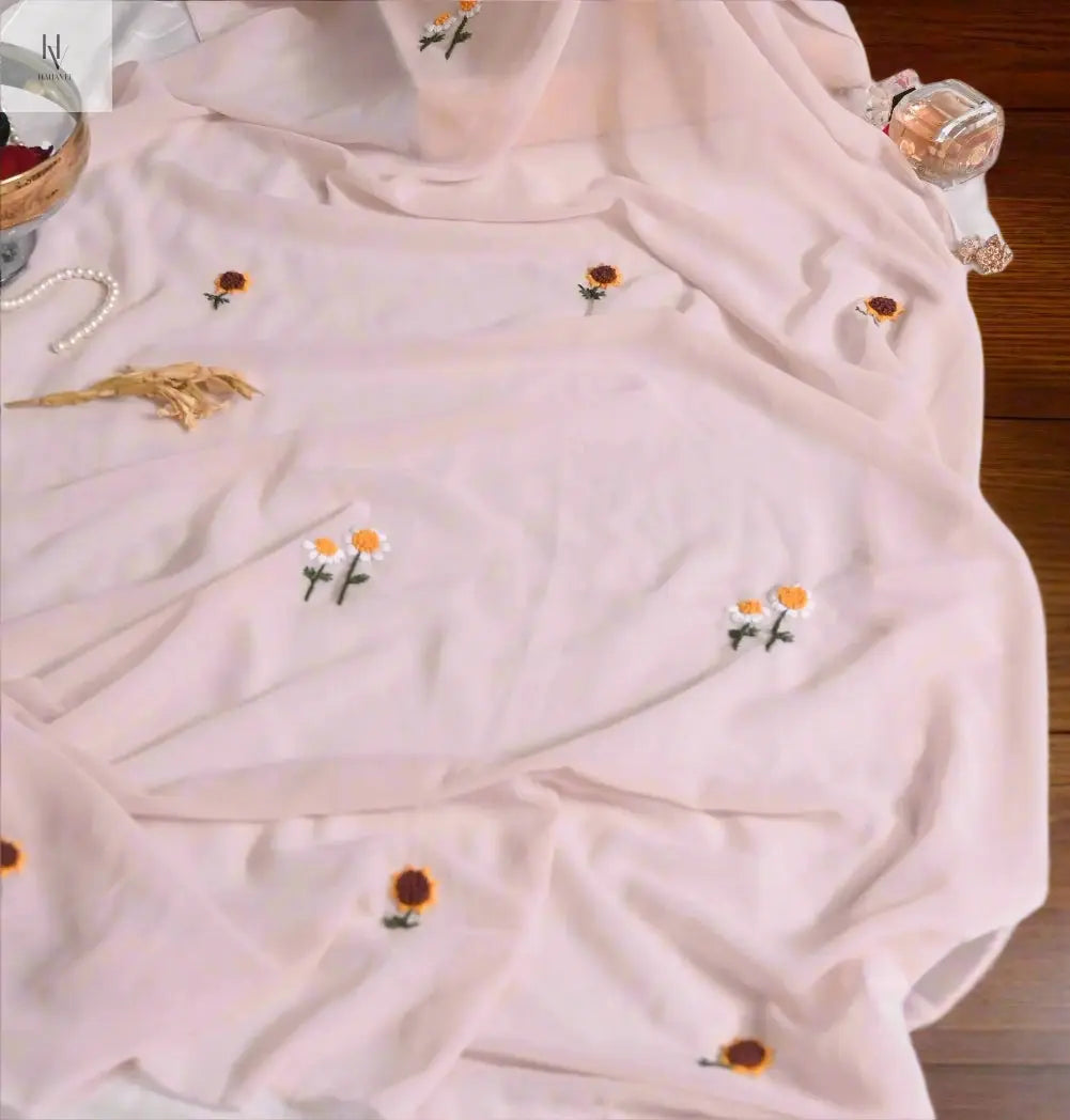 beige hijab with embroidered flowers on a light background